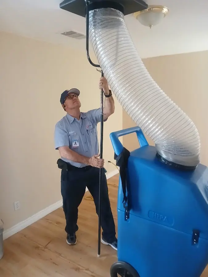 Furnace Tune-Up technician using HEPA equipment in Westfield